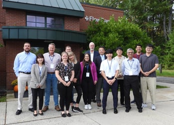 Group photo of FlowCam international partners in front of Yokogawa Fluid Imaging headquarters