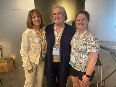 3 women smiling at camera