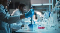 Scientist's hand using pipettor