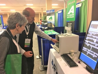 Harry Nelson showing FlowCam at conference exhibition