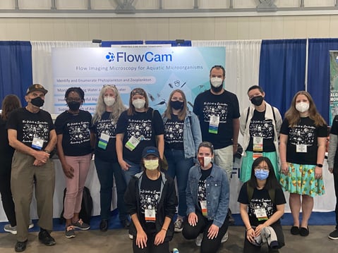 Group photo of aquatic sciences at the OSM 2022 FlowCam booth, wearing matching tshirts