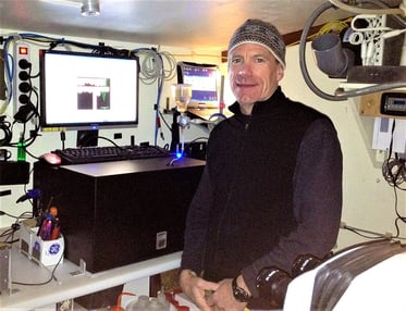 Harry Nelson with FlowCam onboard Tara Oceans Project vessel