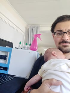 Yokogawa Fluid Imaging Technologies customer service working at home during quarantine with baby