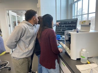 Bates College students looking at FlowCam data on screen