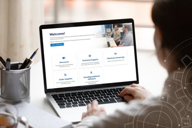 Scientist using a laptop with FlowCam Customer Support Center dashboard on screen