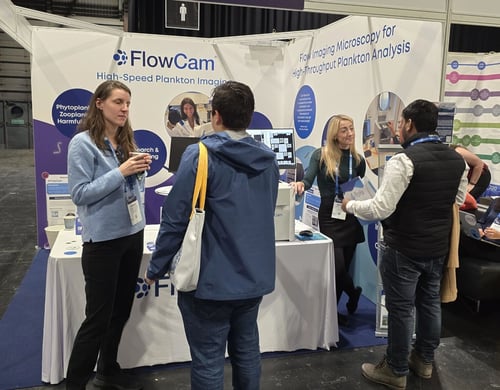 FlowCam booth talking to conference attendees