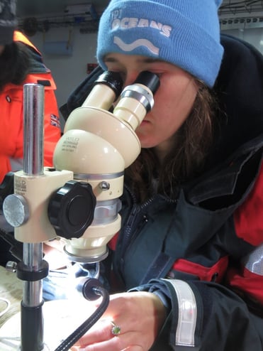 Woman using microscope
