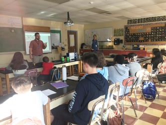 FlowCam presenting science to middle school students in a classroom