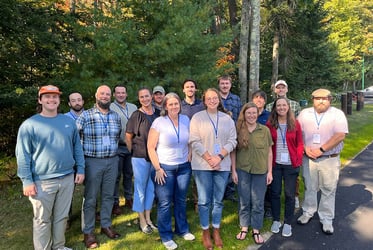 Group of people standing in front of trees