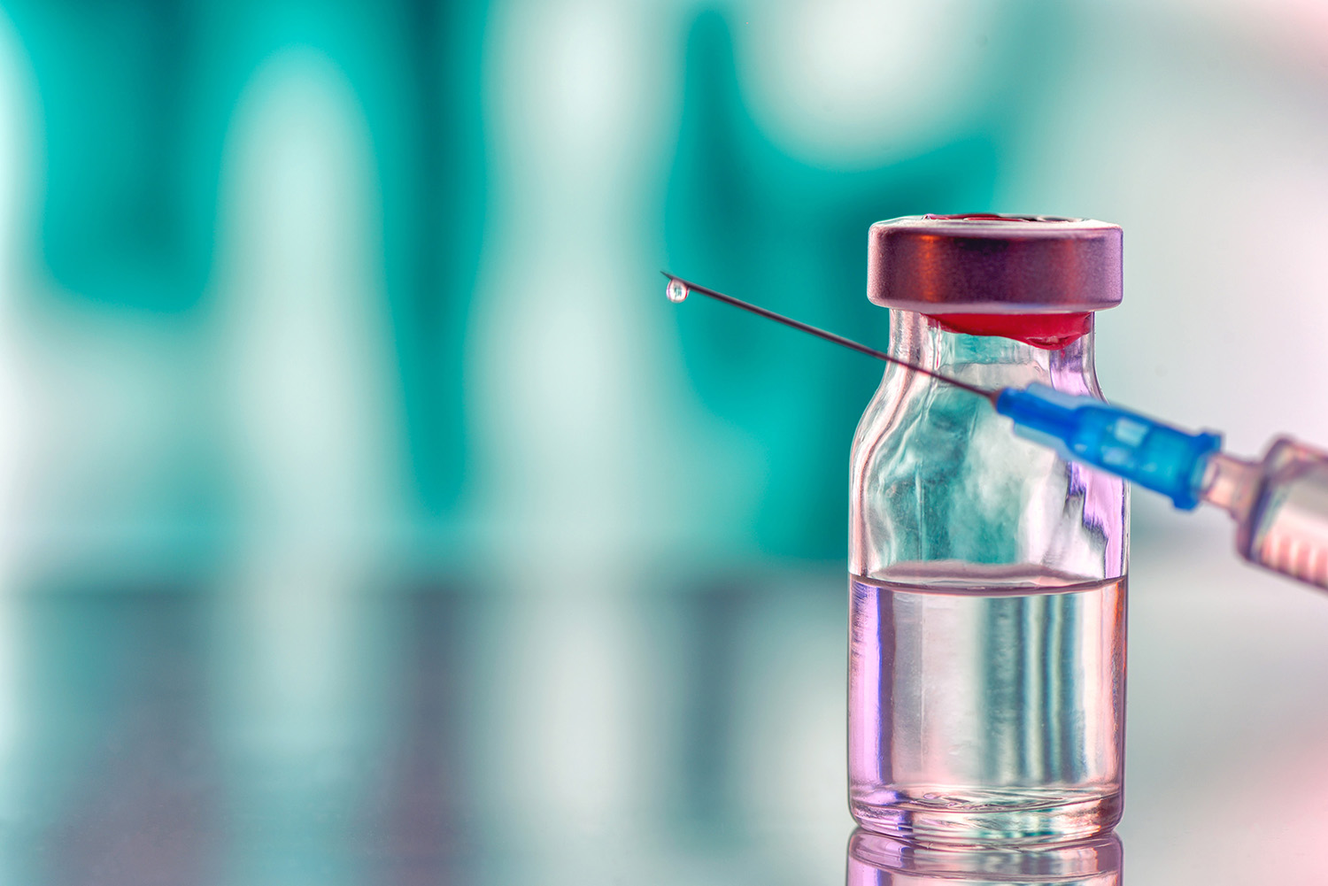 Stock photo of biotherapeutic vial and syringe