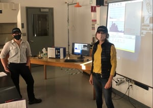 2 women in masks in classroom with FlowCam