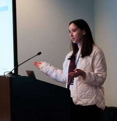 A woman speaking at a podium