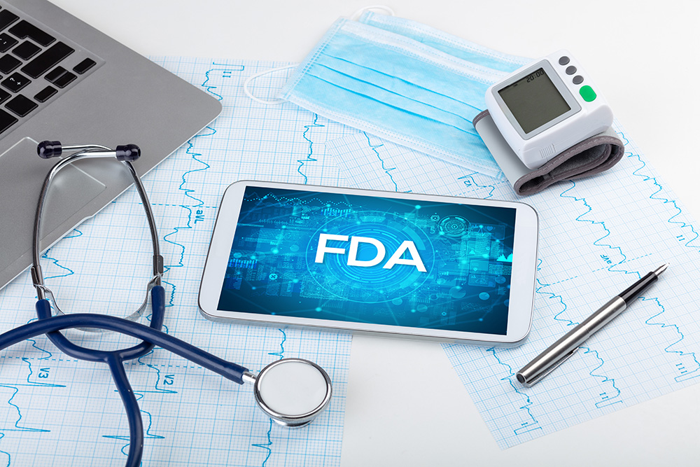 Stock photo of laptop, stethescope, and tablet with FDA graphic