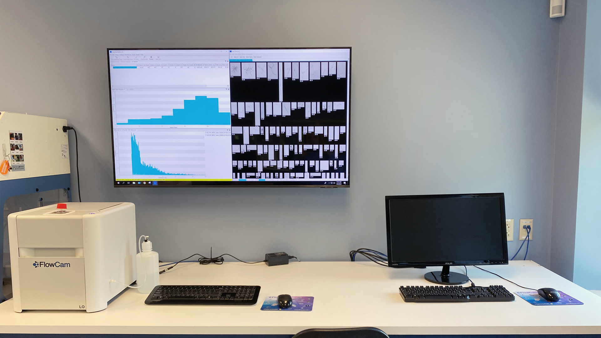 FlowCam on lab bench with data showing on screen