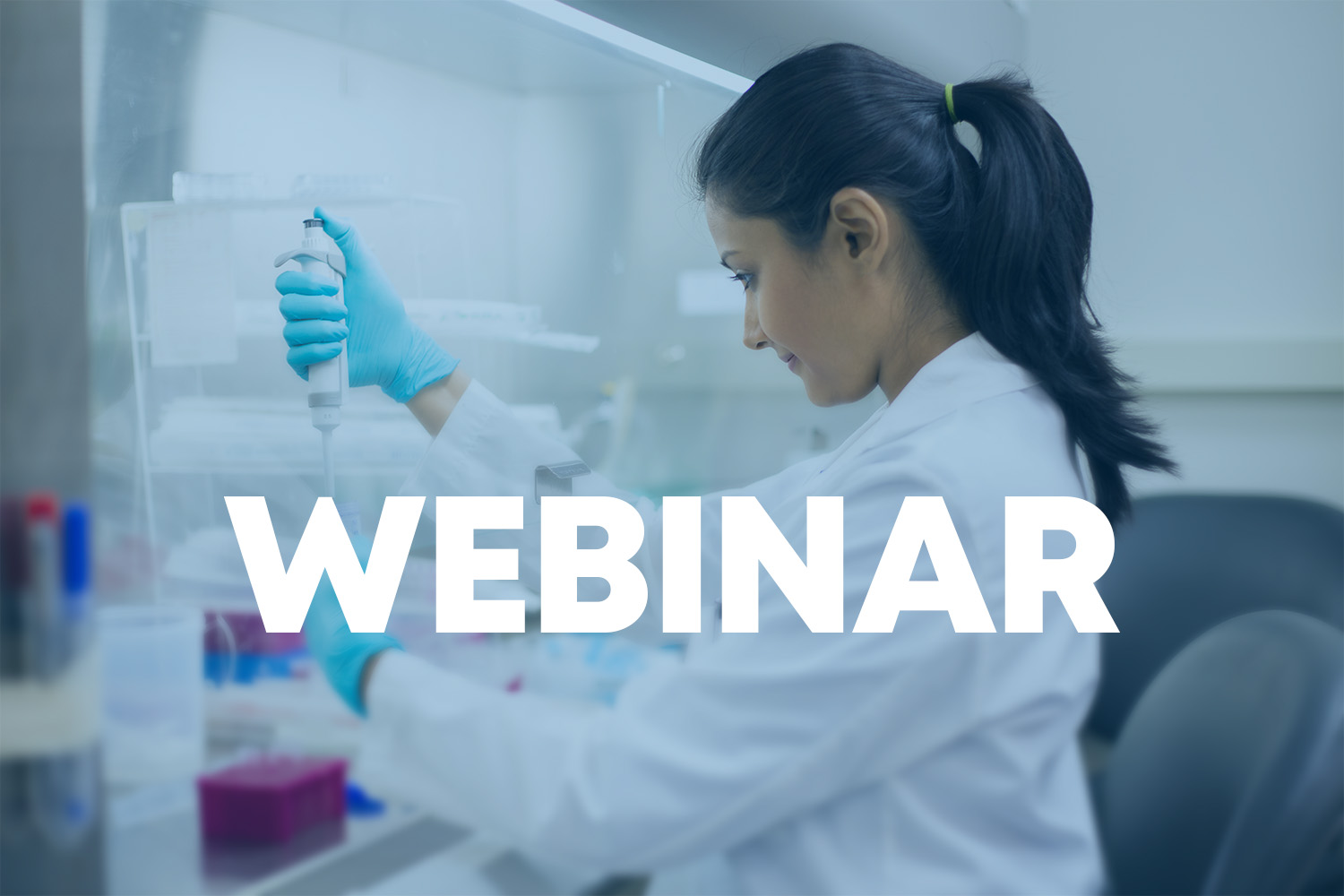 Woman scientist in lab using pipettor, with the word 