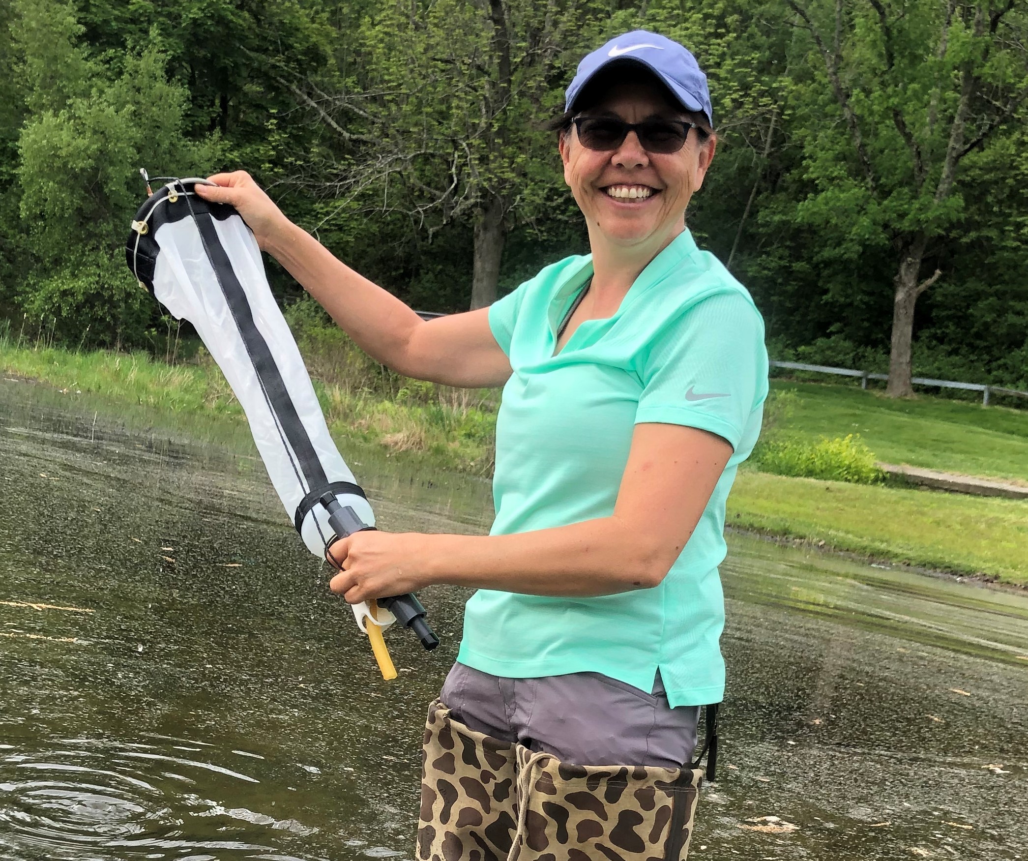 FlowCam user in Worcester, Massachusetts, collecting a water sample during a harmful algal bloom