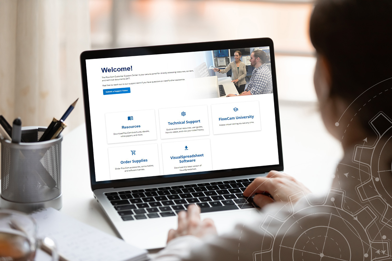 Woman looking at laptop screen showing FlowCam support center dashboard