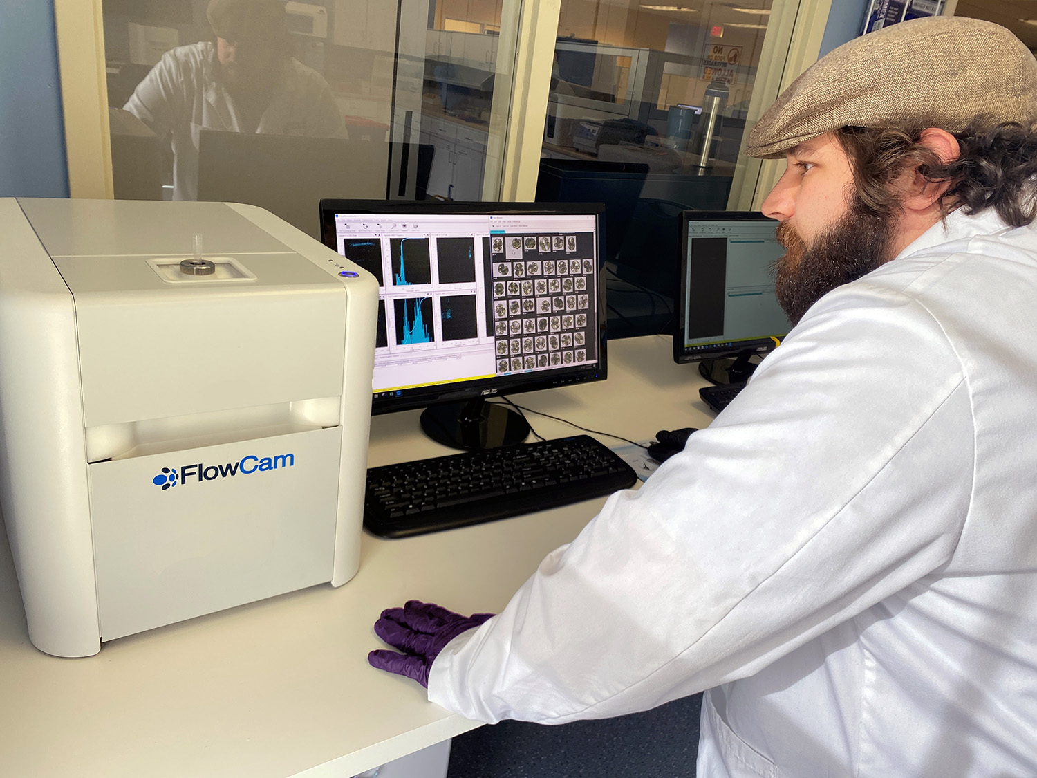 Lab technician using FlowCam 8000 in analytical lab