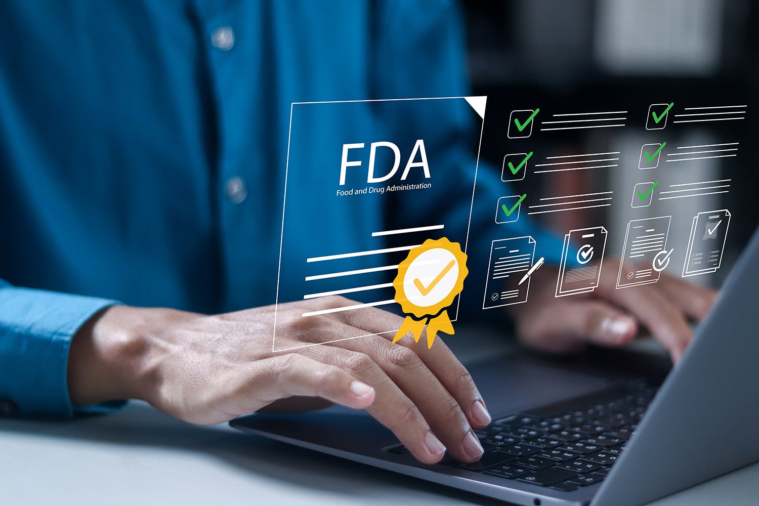 person using laptop with graphics about FDA compliance